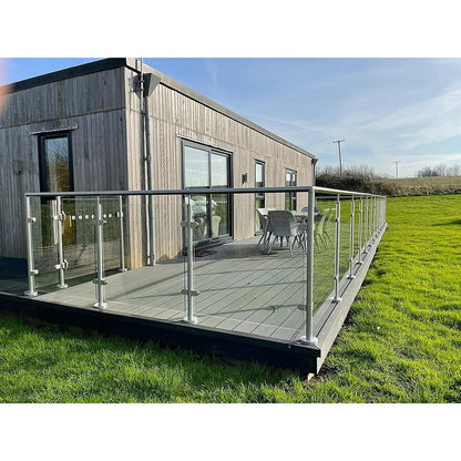 Glass balustrade with 316 stainless steel handrail installed