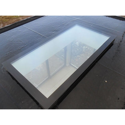Triple glazed flat roof skylight installed on a flat roof