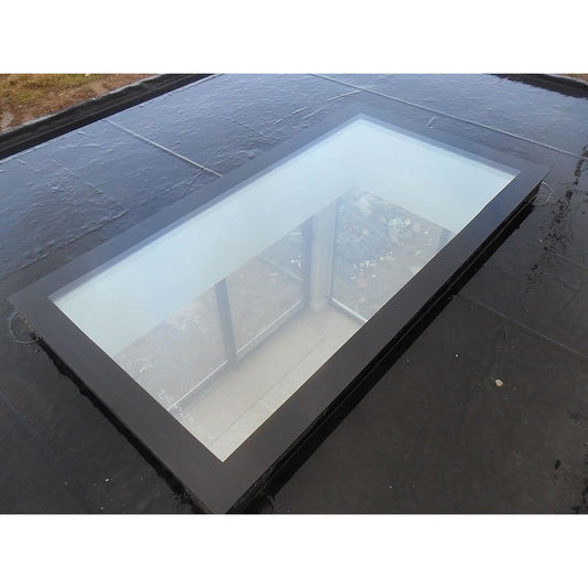 Triple glazed flat roof skylight installed on a flat roof
